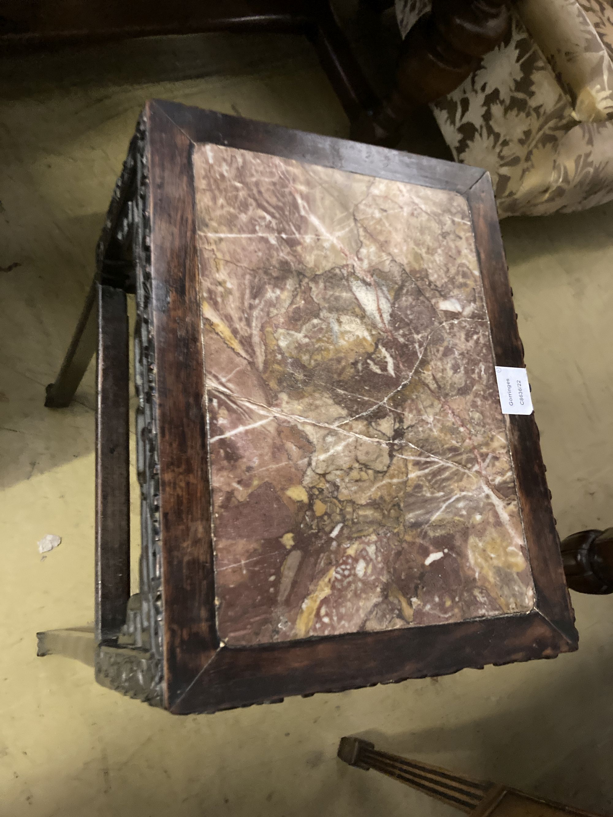 A 19th century Chinese carved hardwood rectangular topped jardiniere stand, with a rouge marble inset top, width 42cm, depth 32cm, heig